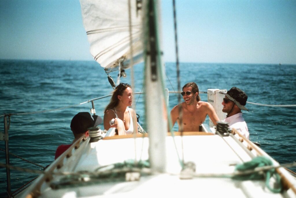 Family sailing on a boat together | Featured image for the Marine Hot Water Systems Page of BCA Australia.